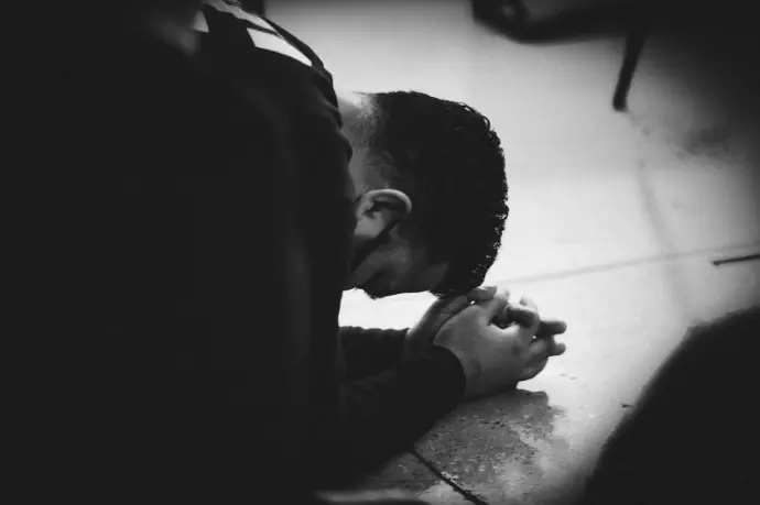 Man bowing down